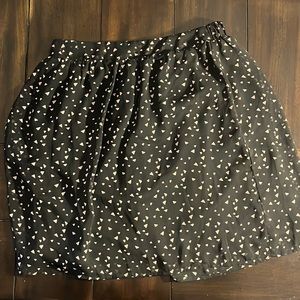 Black and pink women’s skirt by XXI. Size M with elastic waistband.